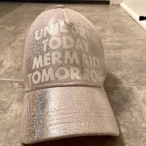 A pink “unicorn today mermaid tomorrow” hat